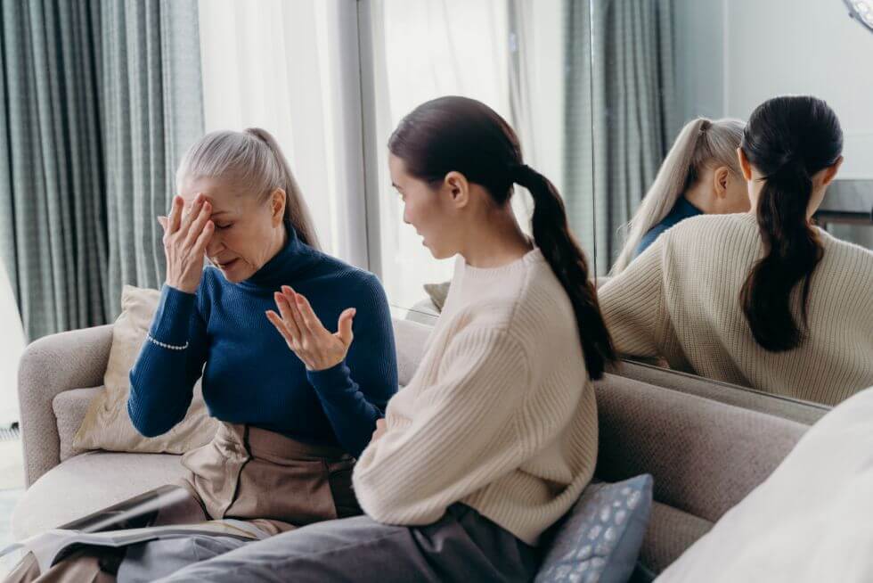 downsizing can be stressful for seniors - mother and daughter talking